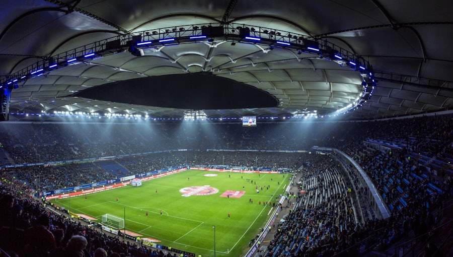 Stadion sepak bola dengan lampu sorot menyala — kategori sportsbook